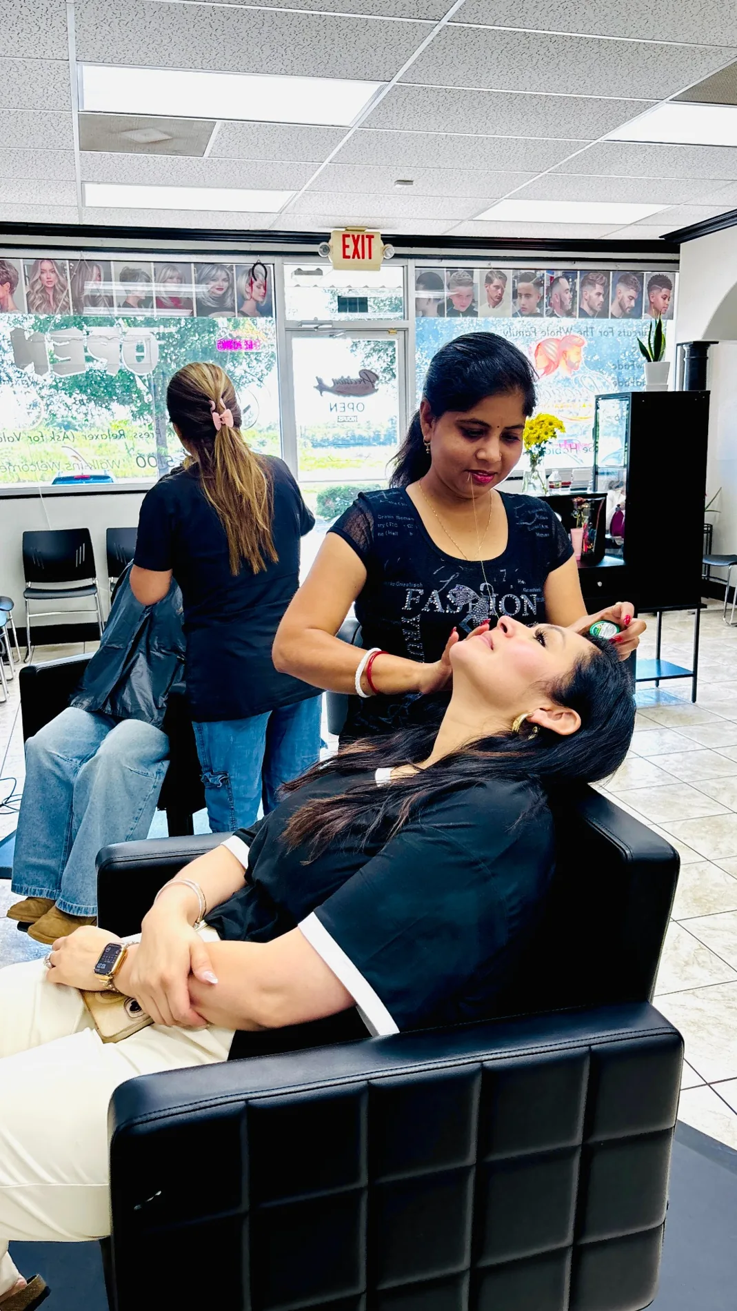 Client receiving threading treatment at Shivani Browz Studio